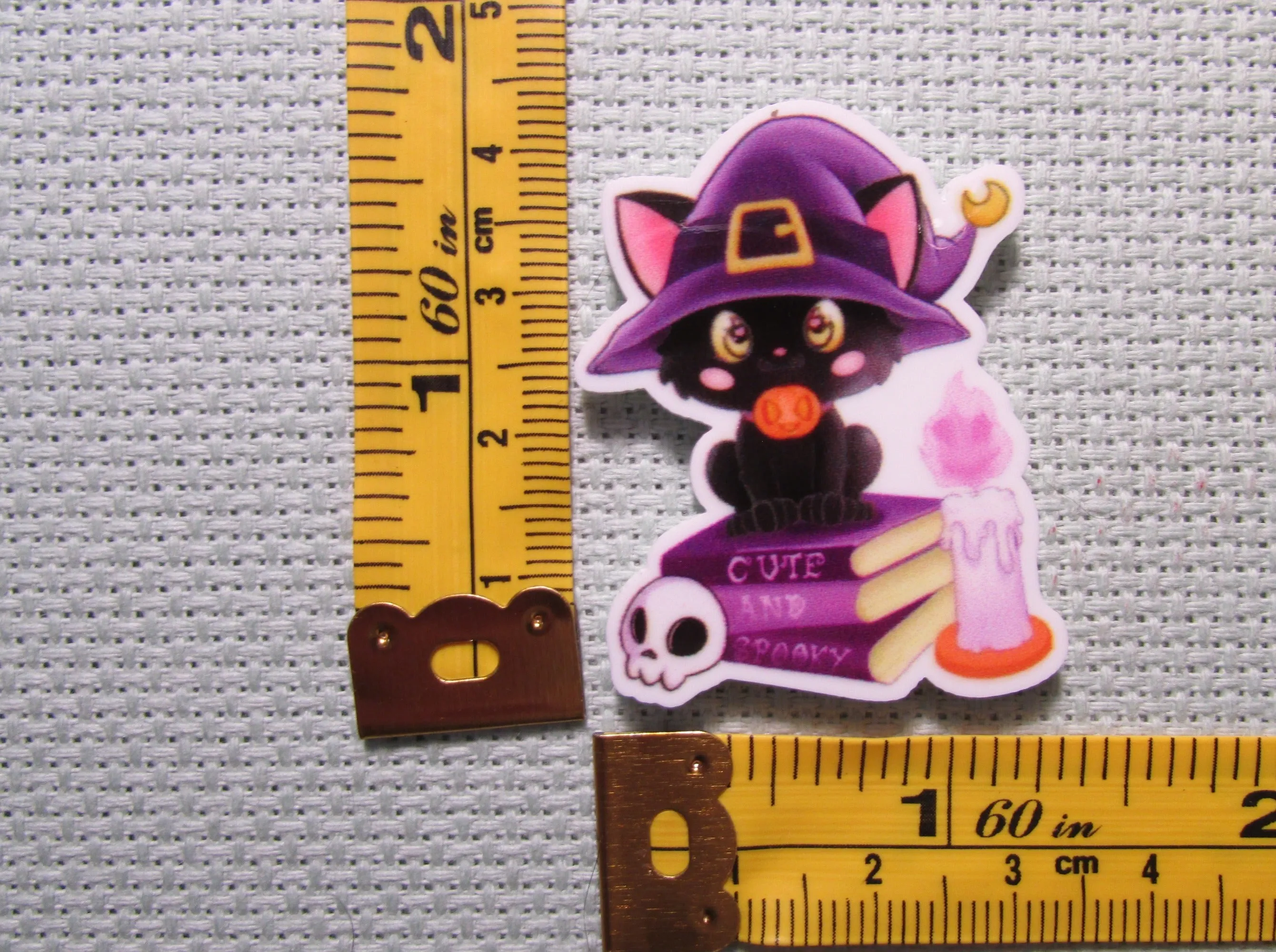 Black Cat Sitting on Spell Books Needle Minder, Cover Minder, Magnet