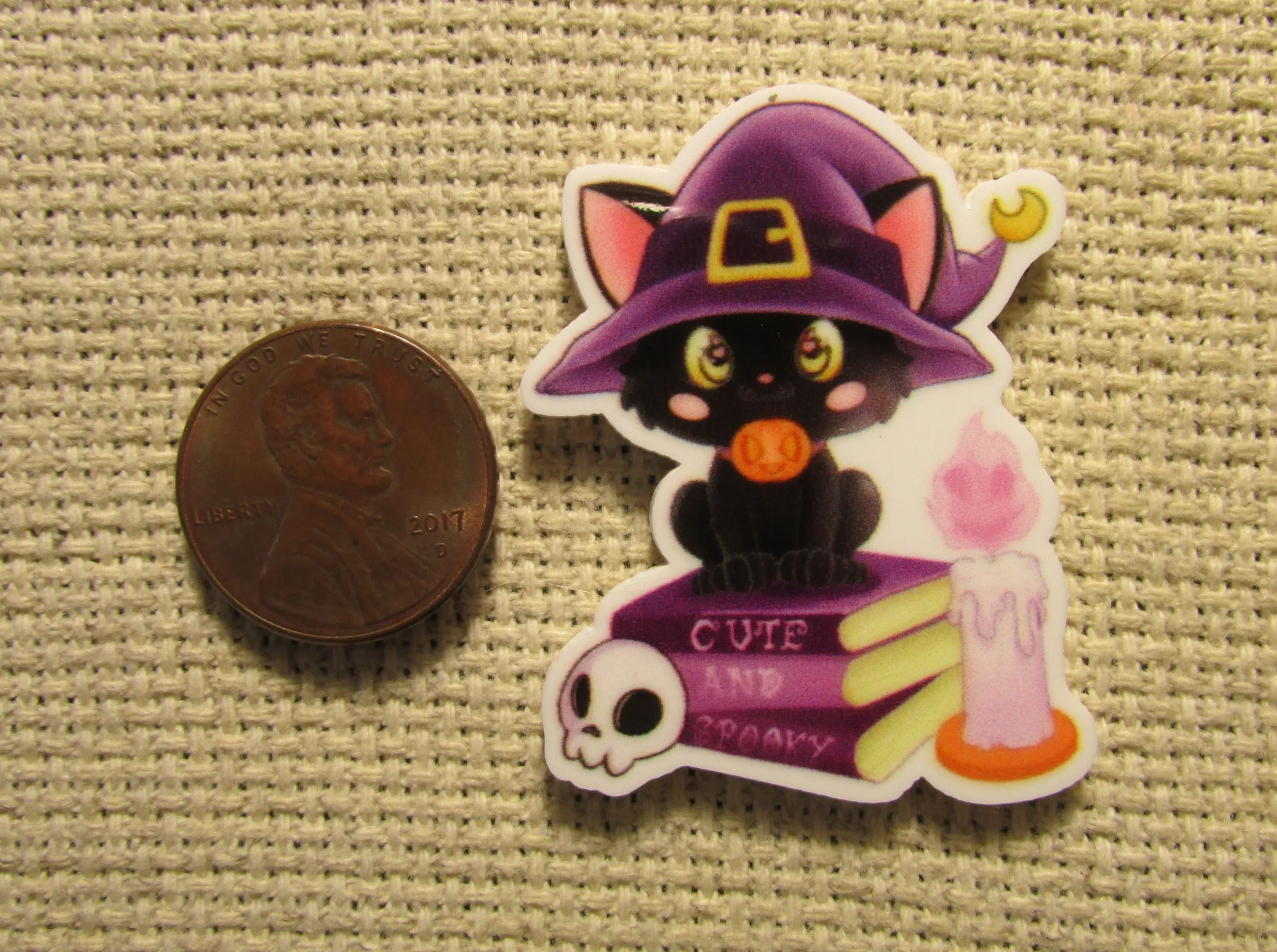 Black Cat Sitting on Spell Books Needle Minder, Cover Minder, Magnet